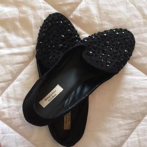 Beautifully embellished black slip ons.